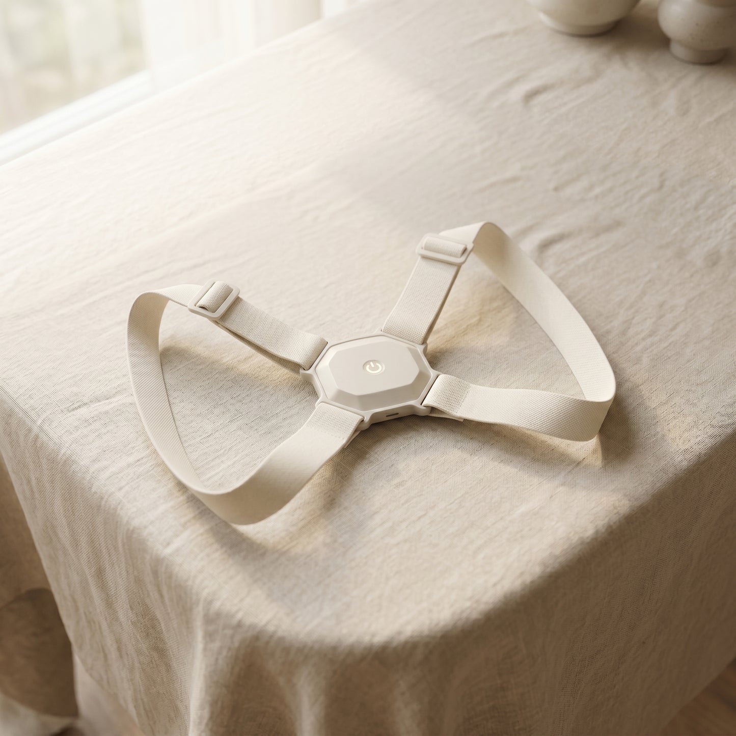 AlignX Pro posture corrector on linen fabric — minimalist premium design